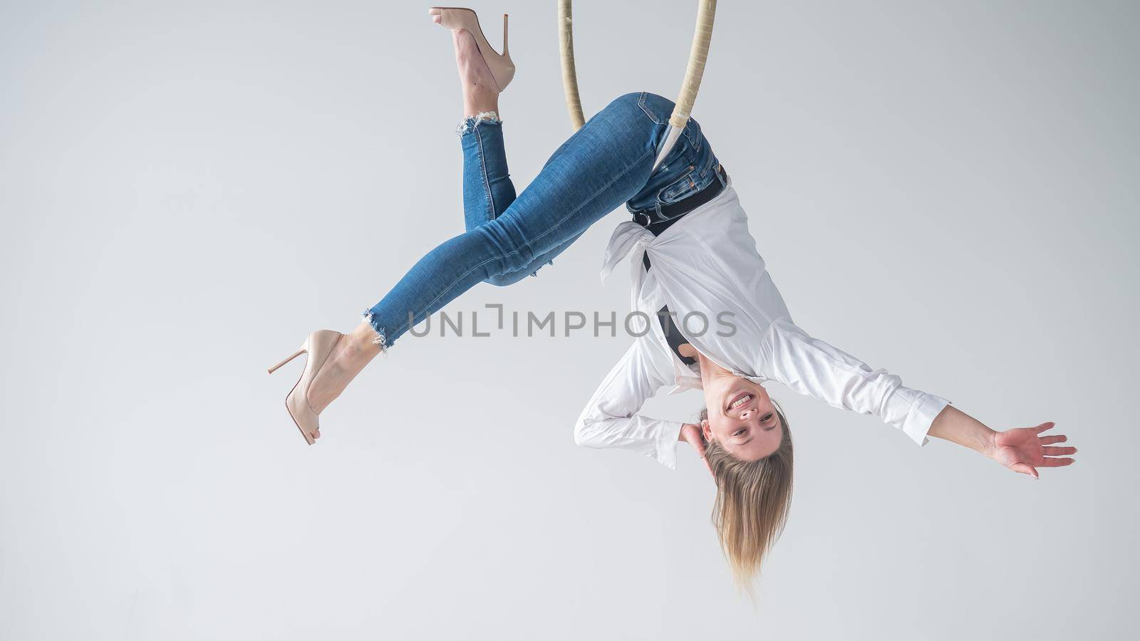 Caucasian woman in daily wear on air hoop