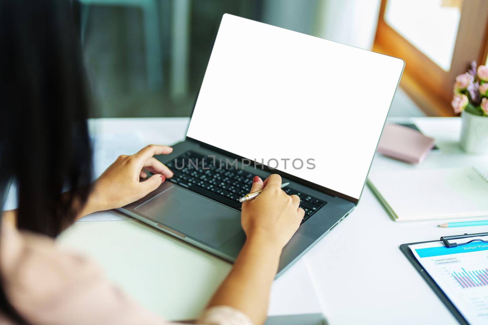 shopping, meeting, information searching, Asian woman using a white screen laptop mockup can insert text, characters or images. by Manastrong