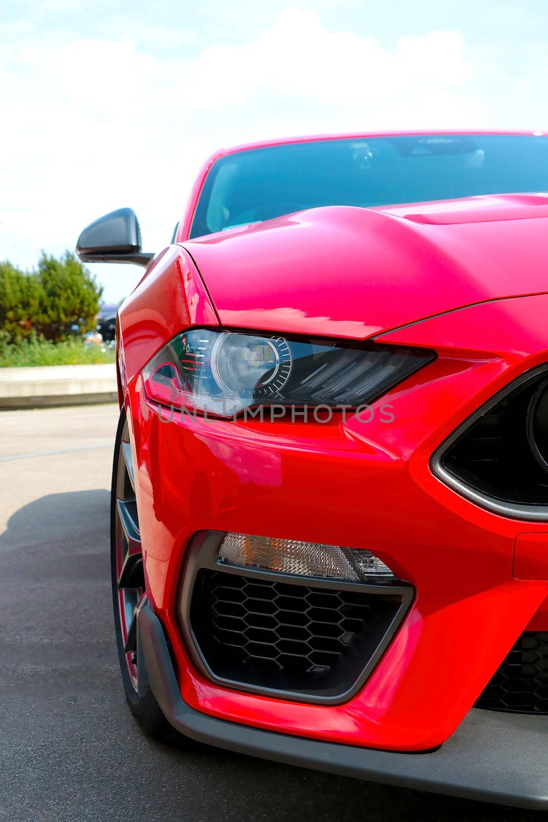 Front view of a red modern car. modern optics