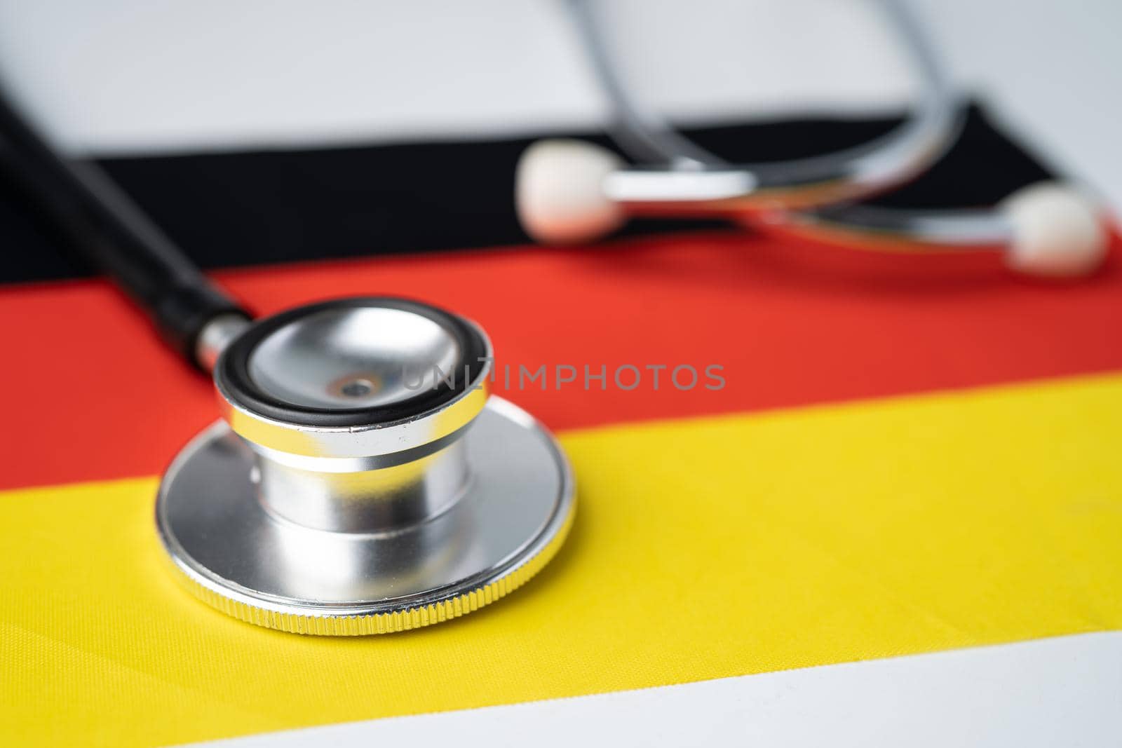 Black stethoscope on Germany flag background, Business and finance concept. by pamai