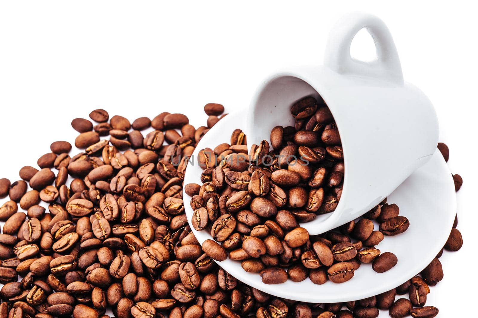 white cup with coffee beans isolated