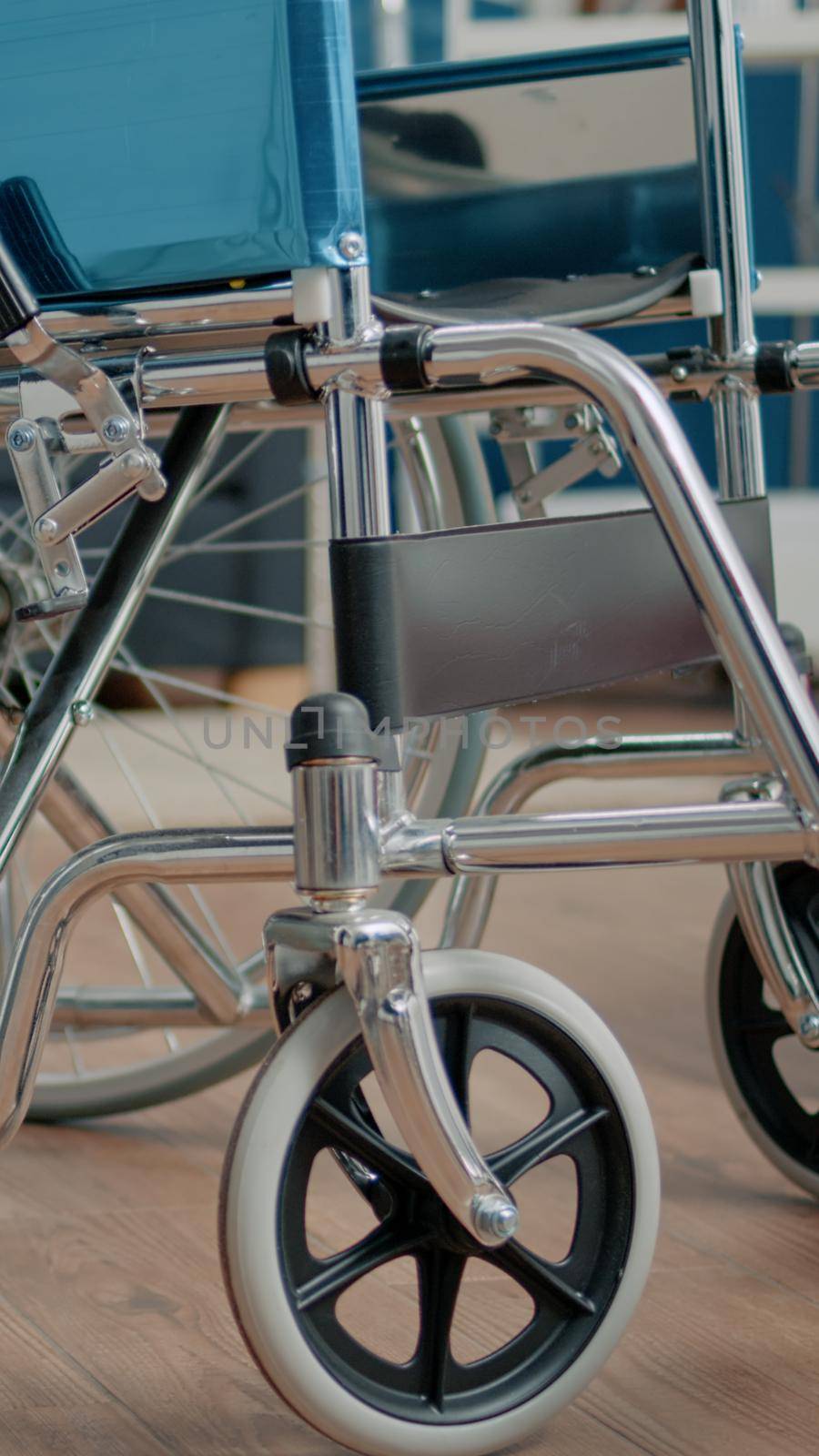 Close up of wheelchair for physical support in nursing home used by disabled people. Object of transportation for medical assistance and rehabilitation. Facility for recovery and treatment