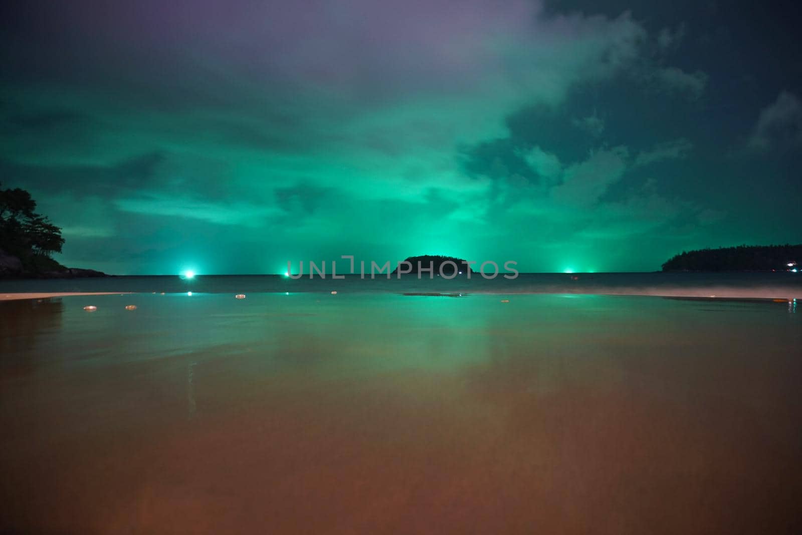 Unusual green illumination of the sky on island by Passcal
