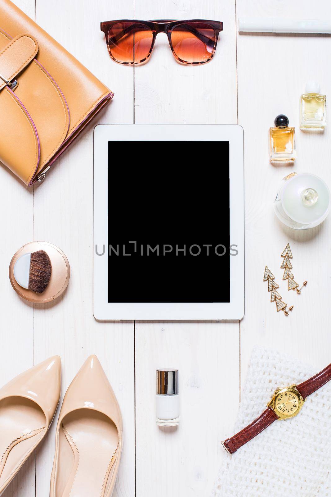 Flat lay, top view, mock up women's clothes and accessories on a white background. shoes, tablet, perfume, sunglasses