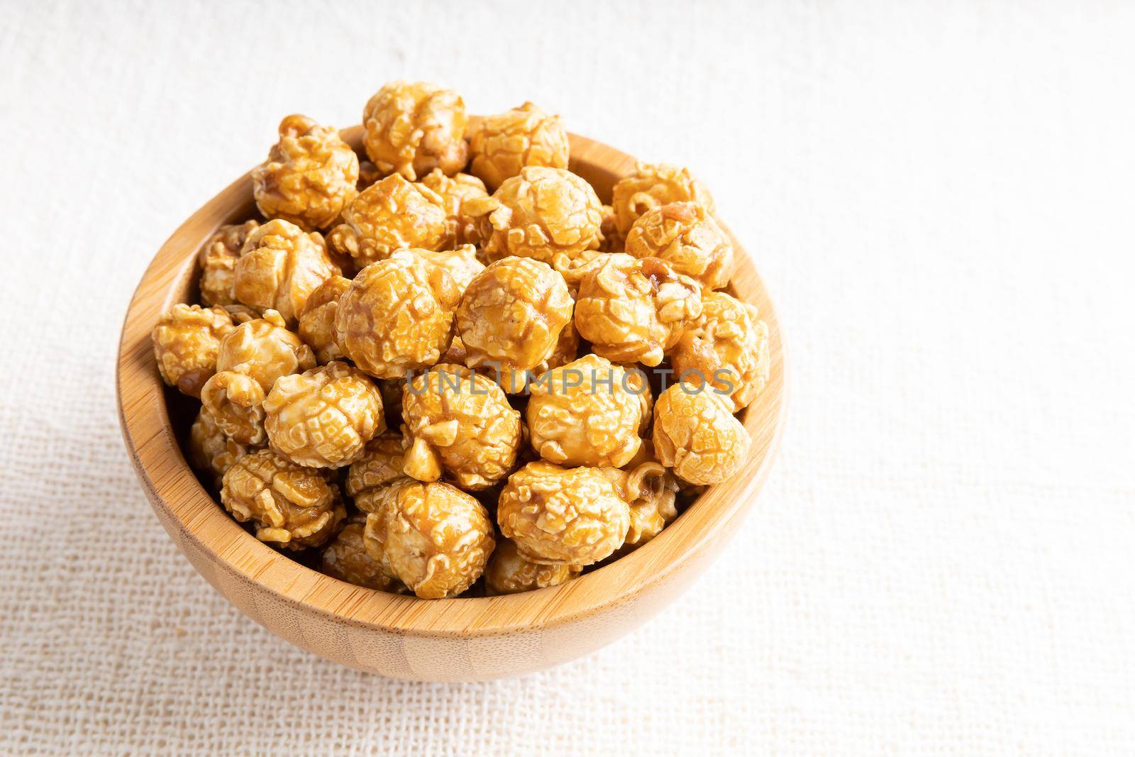Caramel popcorn in bamboo wooden bowl by smuay