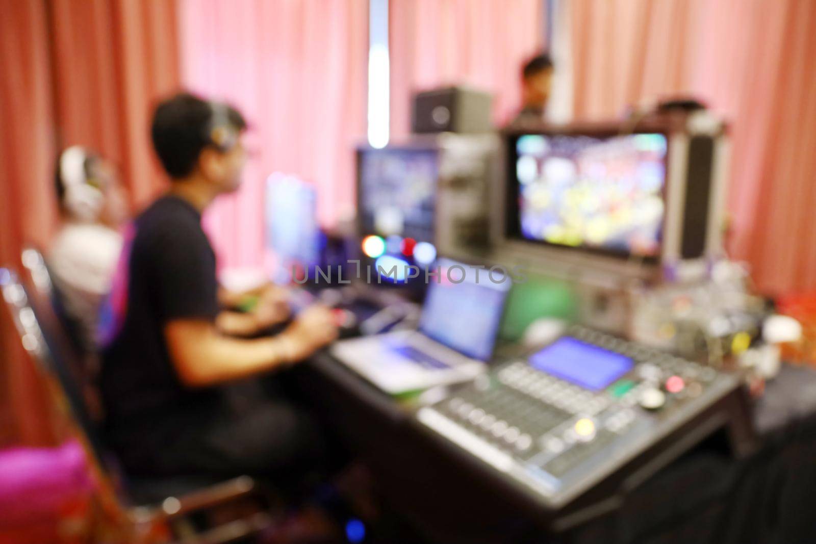 Blur people working at outside broadcasting switcher by smuay