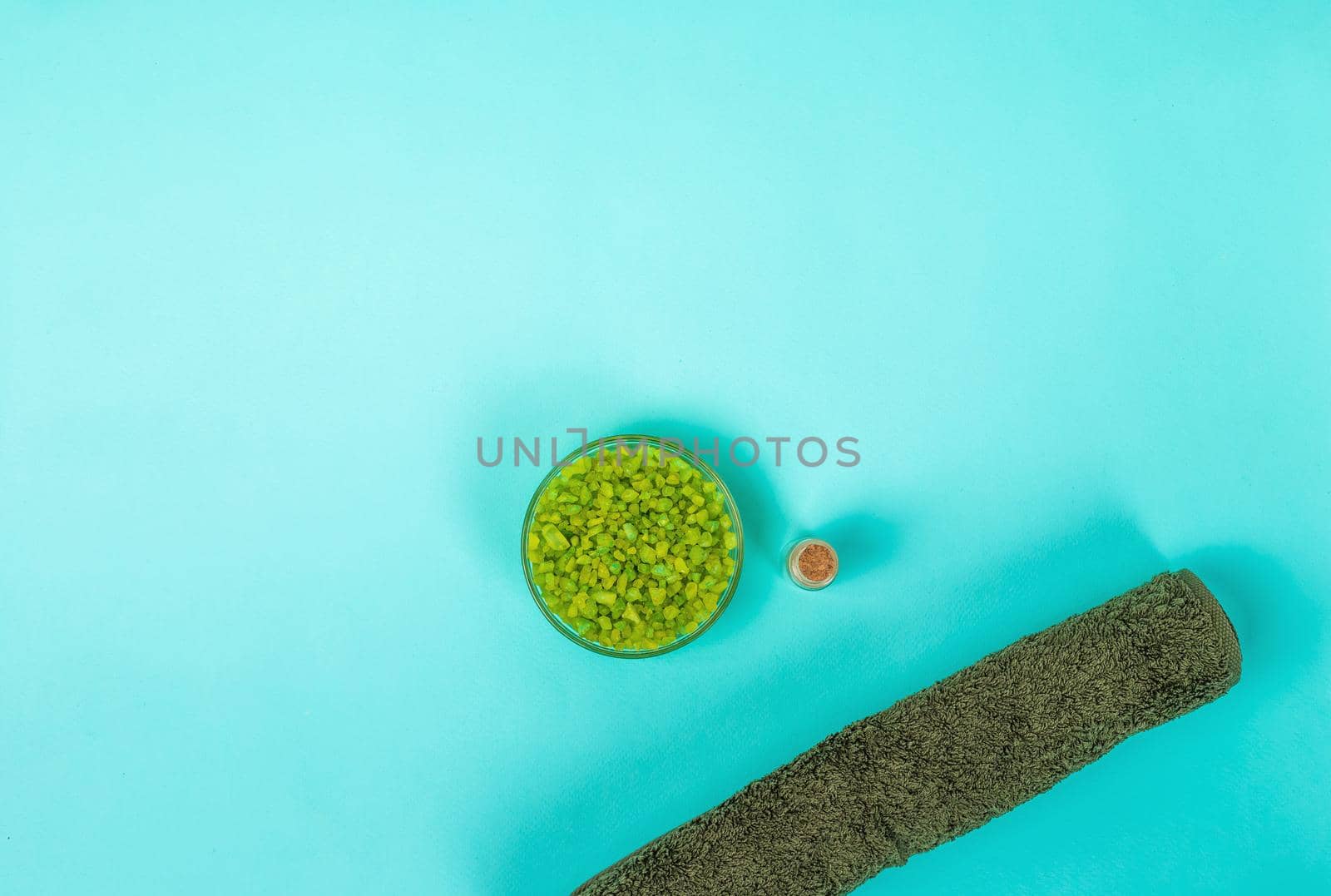 Spa set: oil, sea salt and towel. Top view. Still life. Copy space