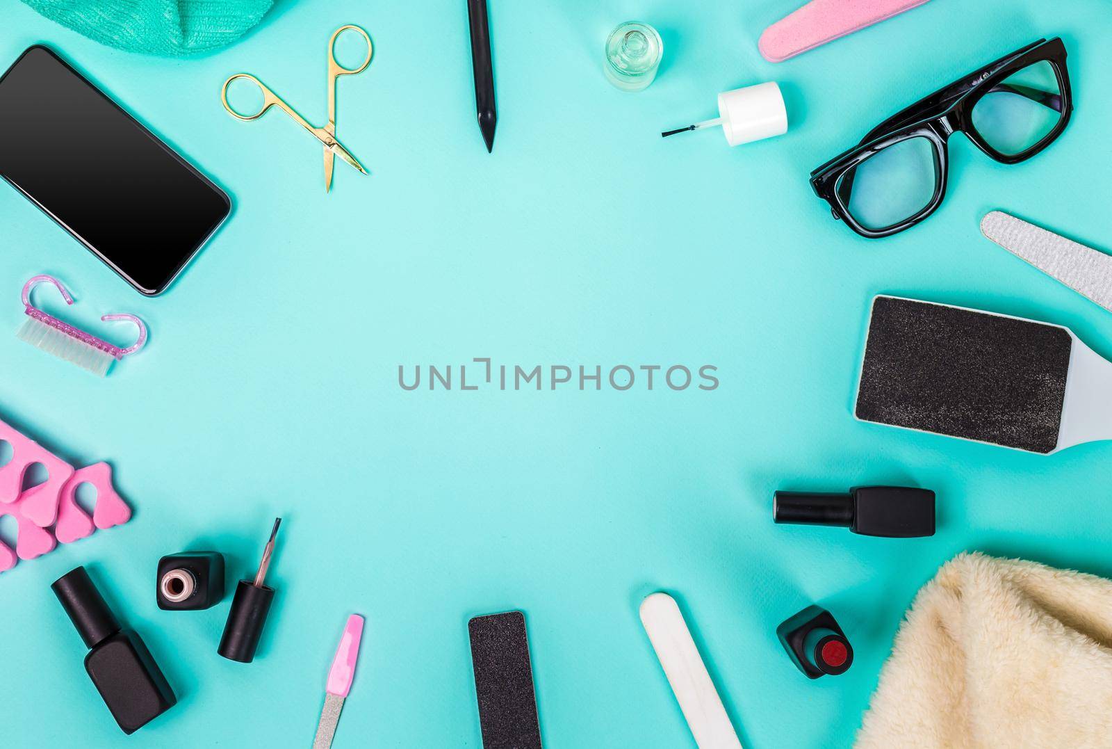 Top view of manicure and pedicure equipment on blue background. Still life. Copy space