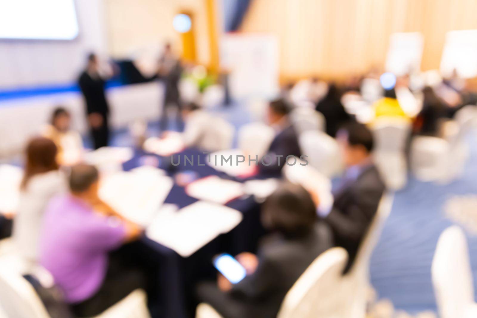 Abstract blur group of people in business training workshop, professional corporate seminar meeting