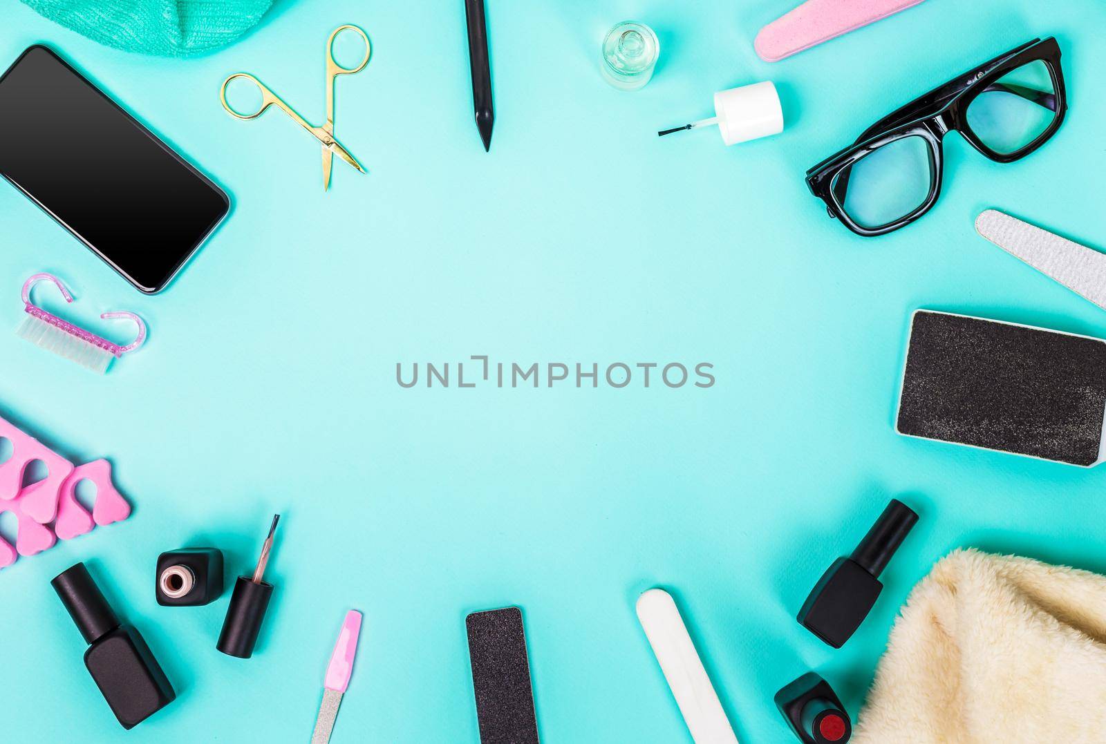 Top view of manicure and pedicure equipment on blue background. Still life. Copy space