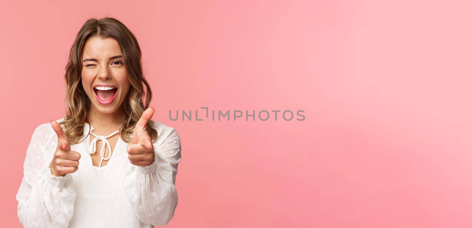 Close-up portrait of sassy and carefree good-looking emotive blond girl, pointing finger pistols at camera as asking join her team, become member, inviting try product yourself, smiling cheeky by Benzoix
