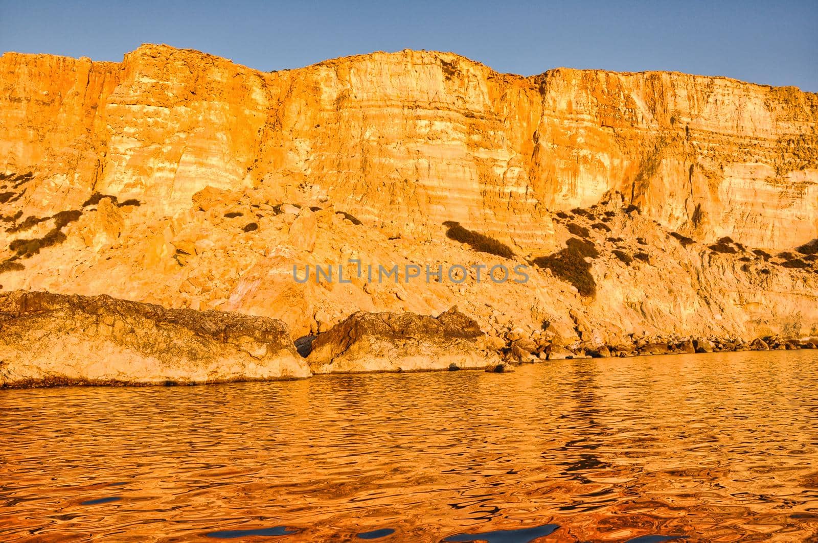 Coast of Crete island in Greece. Red Beach of famous Matala. Filtered retro toned style.