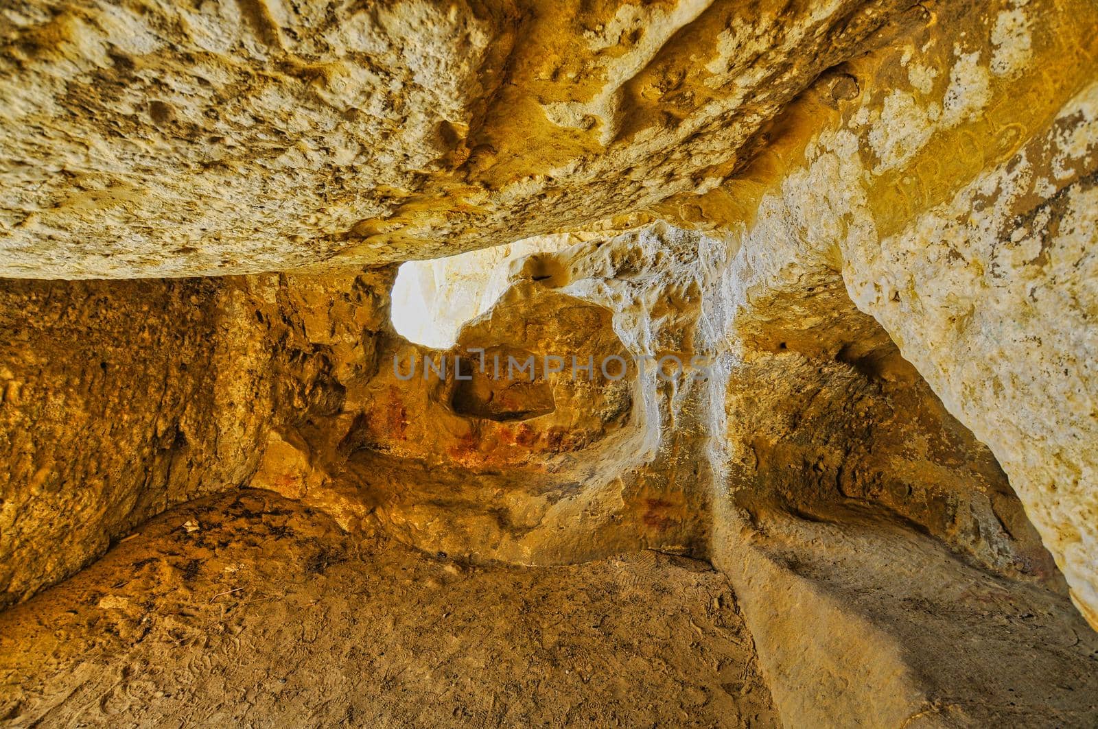 Matala beach with caves on the rocks that were used as a roman cemetery and at the decade of 70's