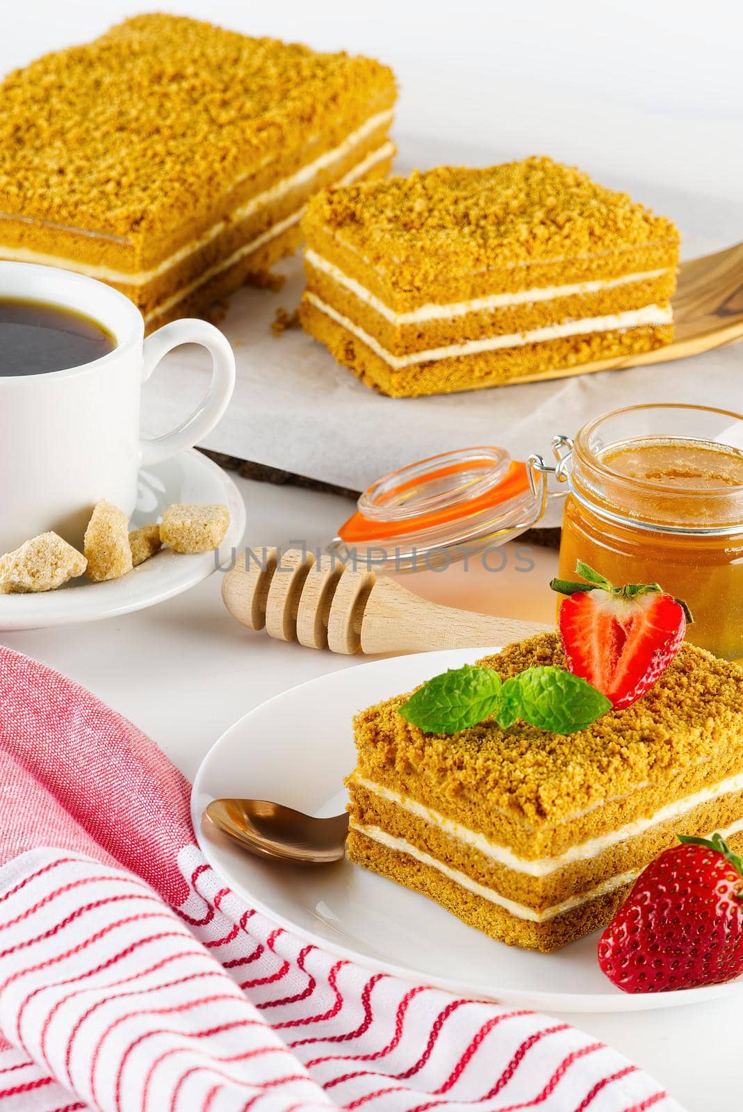 Tasty dessert honey cake. Slice of layered honey cake. by PhotoTime