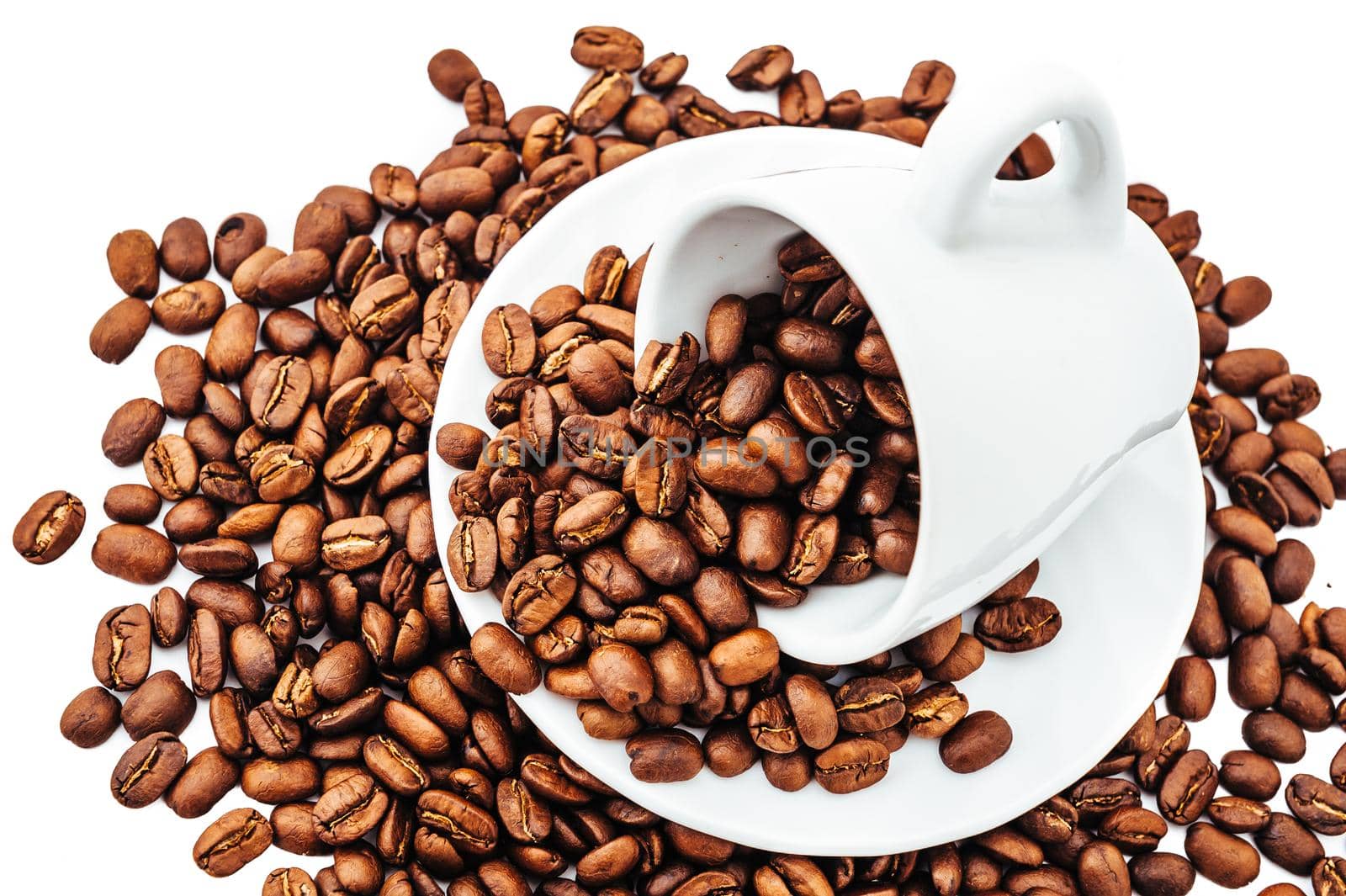 white cup with coffee beans isolated