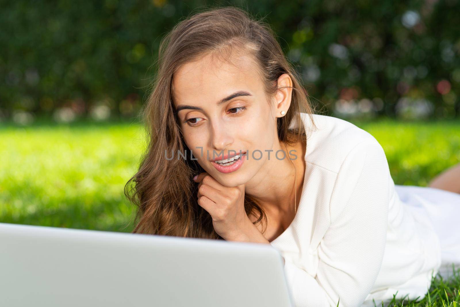 young woman and laptop in the park by adam121