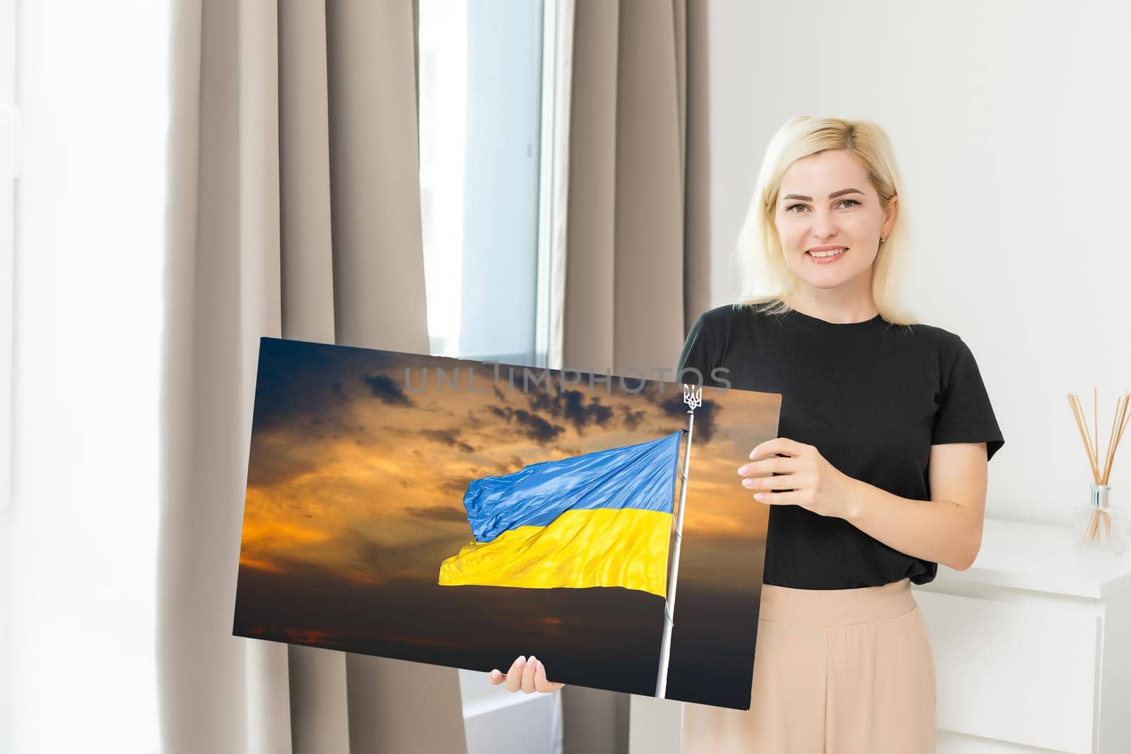 Blue and yellow flag of Ukraine paints on a canvas, national flag of Ukraine.