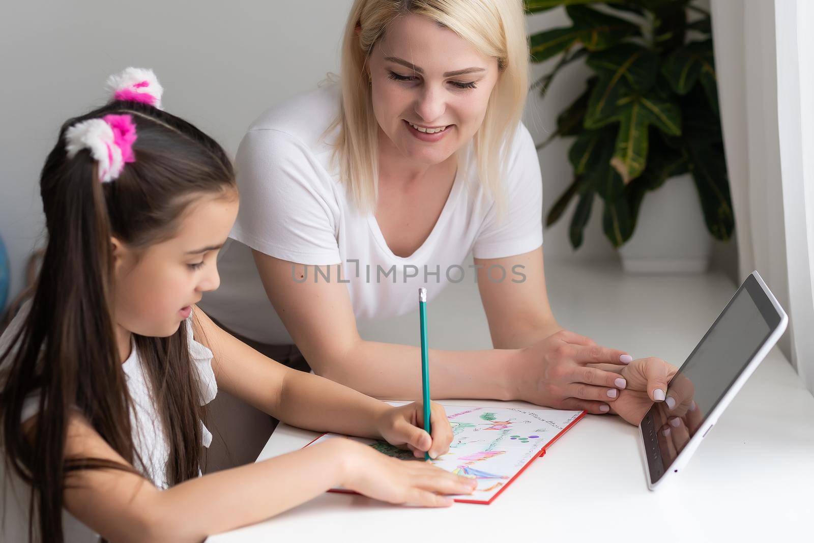 picture of mother and daughter with tablet pc.