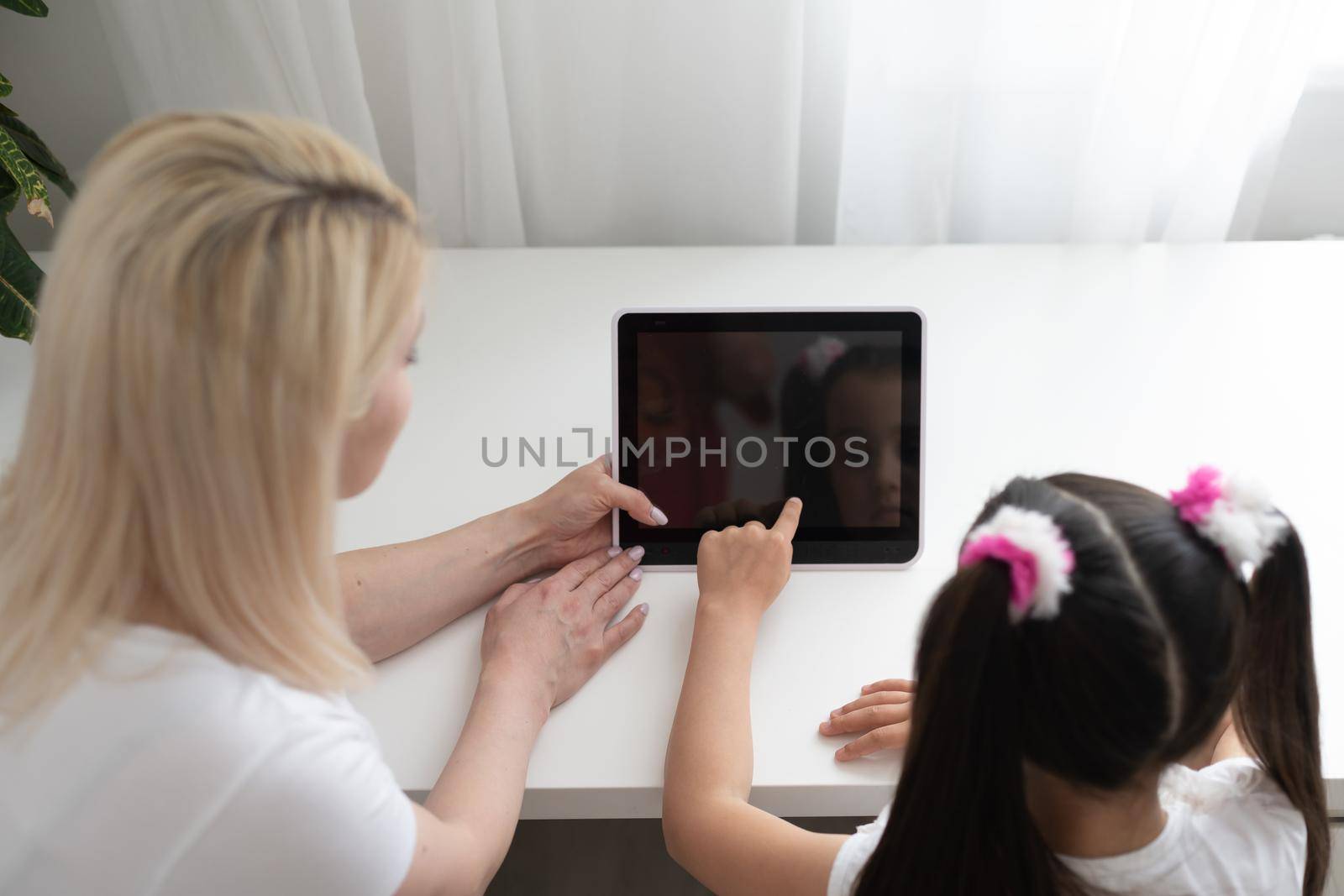 picture of mother and daughter with tablet pc.