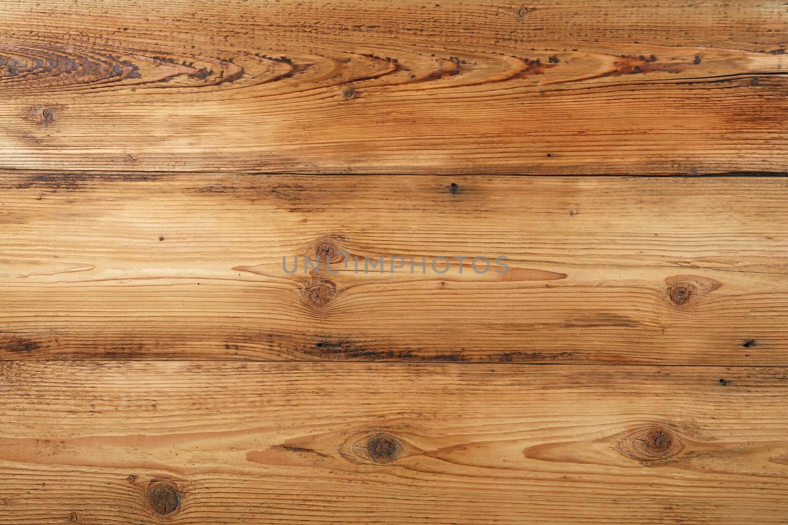Light brown old vintage knotty wooden wide planks wall background texture