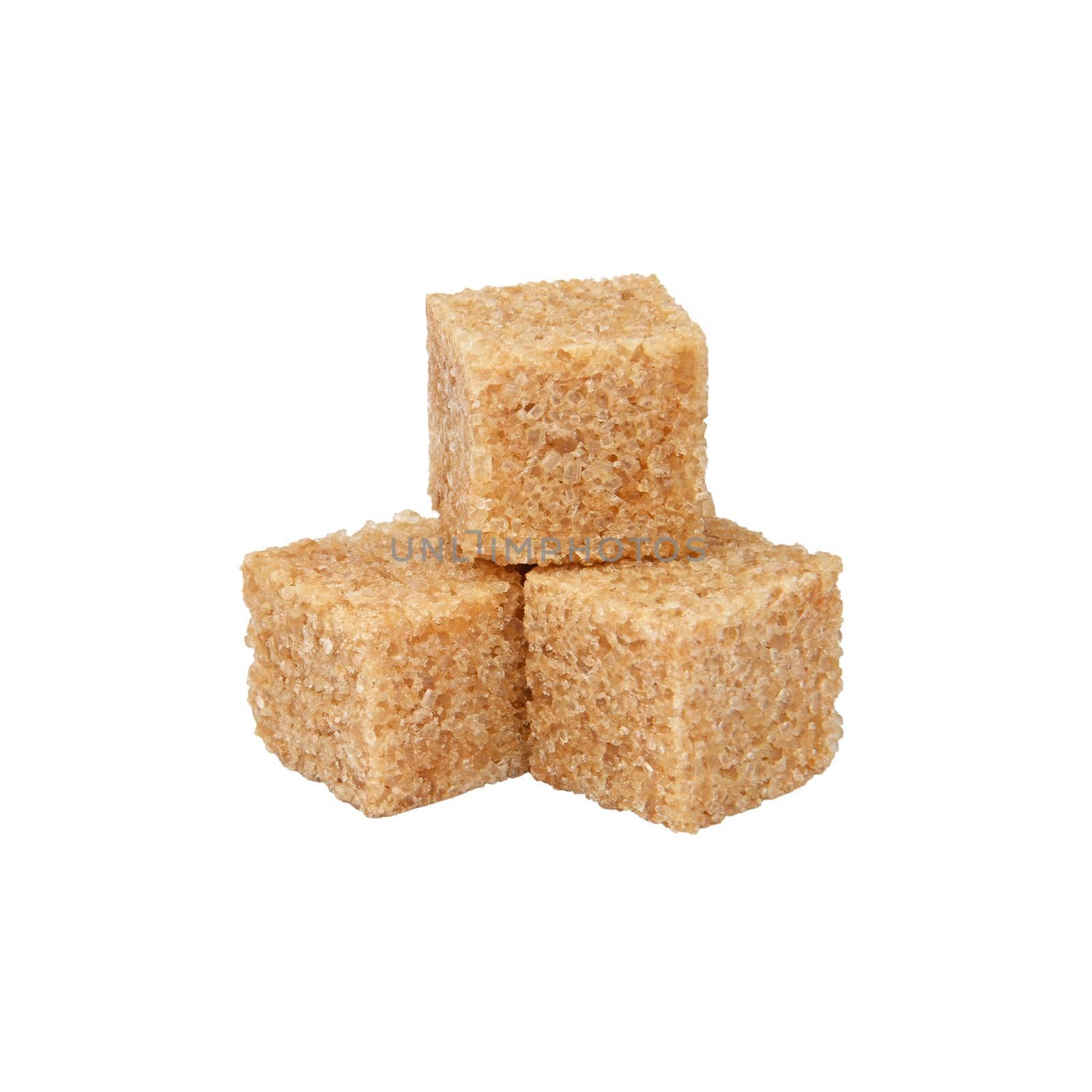 Close up group of brown demerara sugar cubes isolated on white background, side view