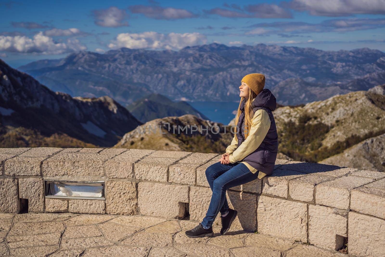 Woman traveller in mountain landscape at national park Lovcen, Montenegro. Travel to Montenegro concept by galitskaya