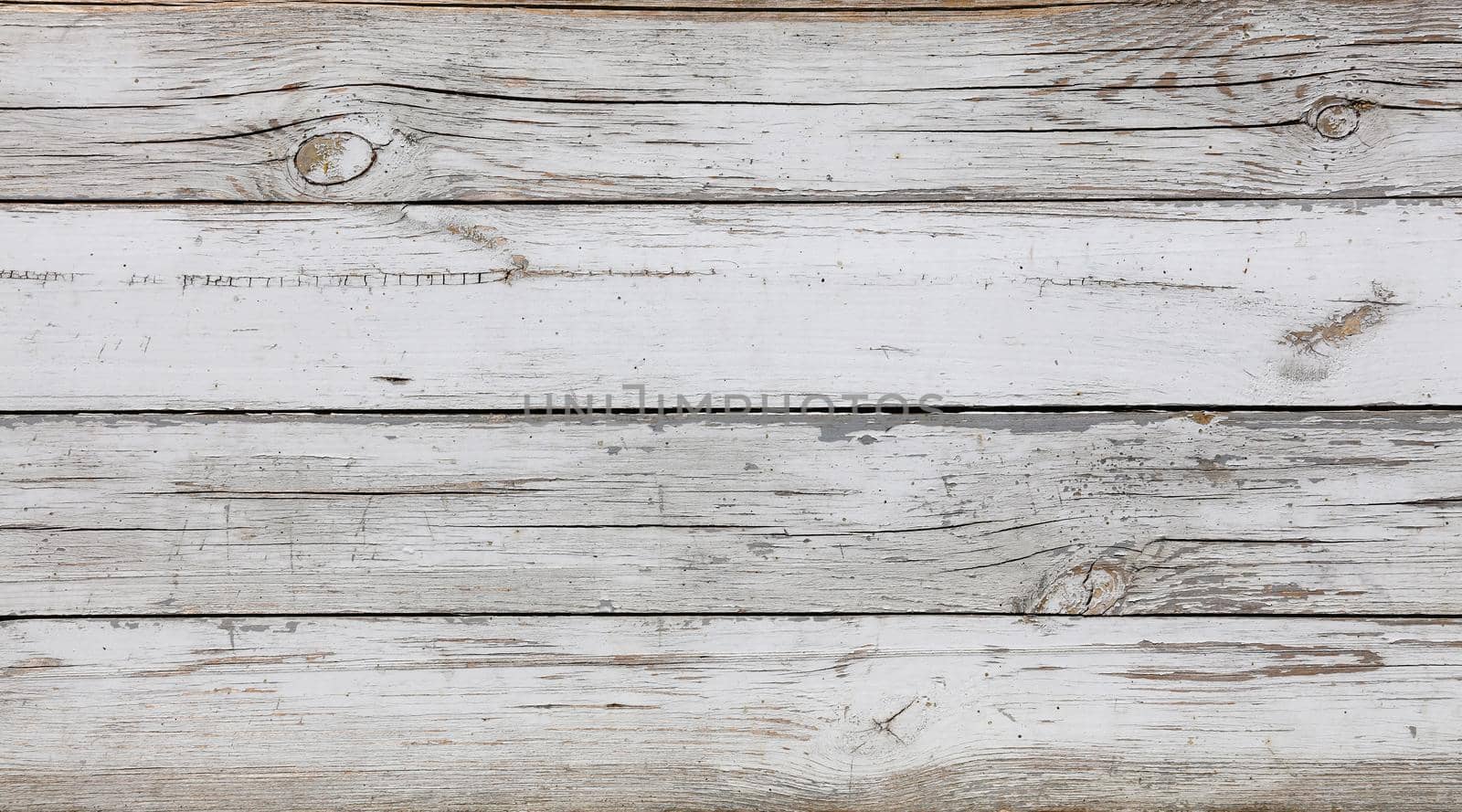 Close up background texture of old vintage weathered white painted grunge wooden planks with brown wood grain