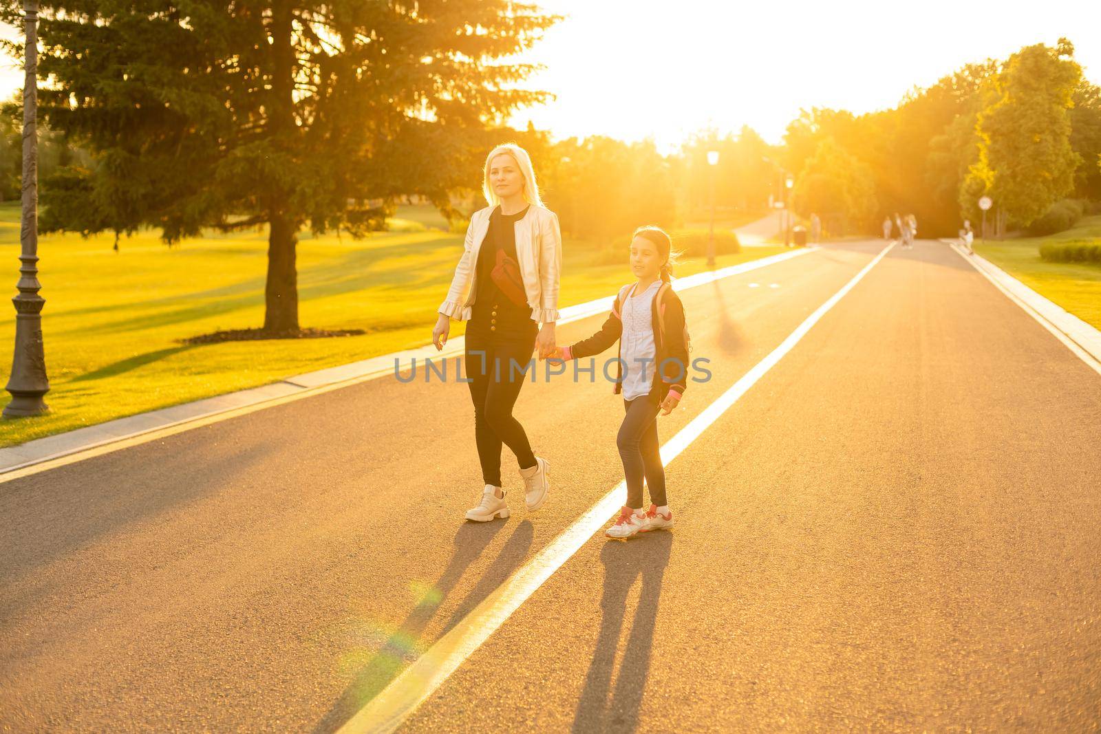 Parent taking child to school.