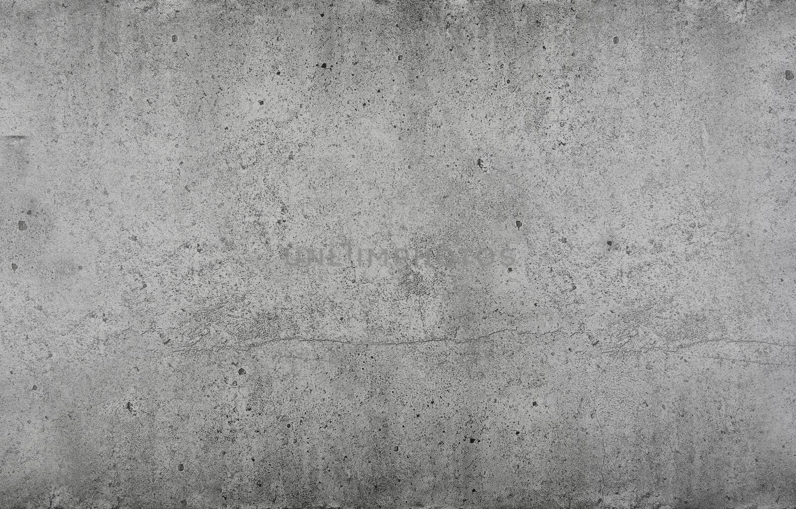 Grunge grey uneven stone texture background with cracks and stains