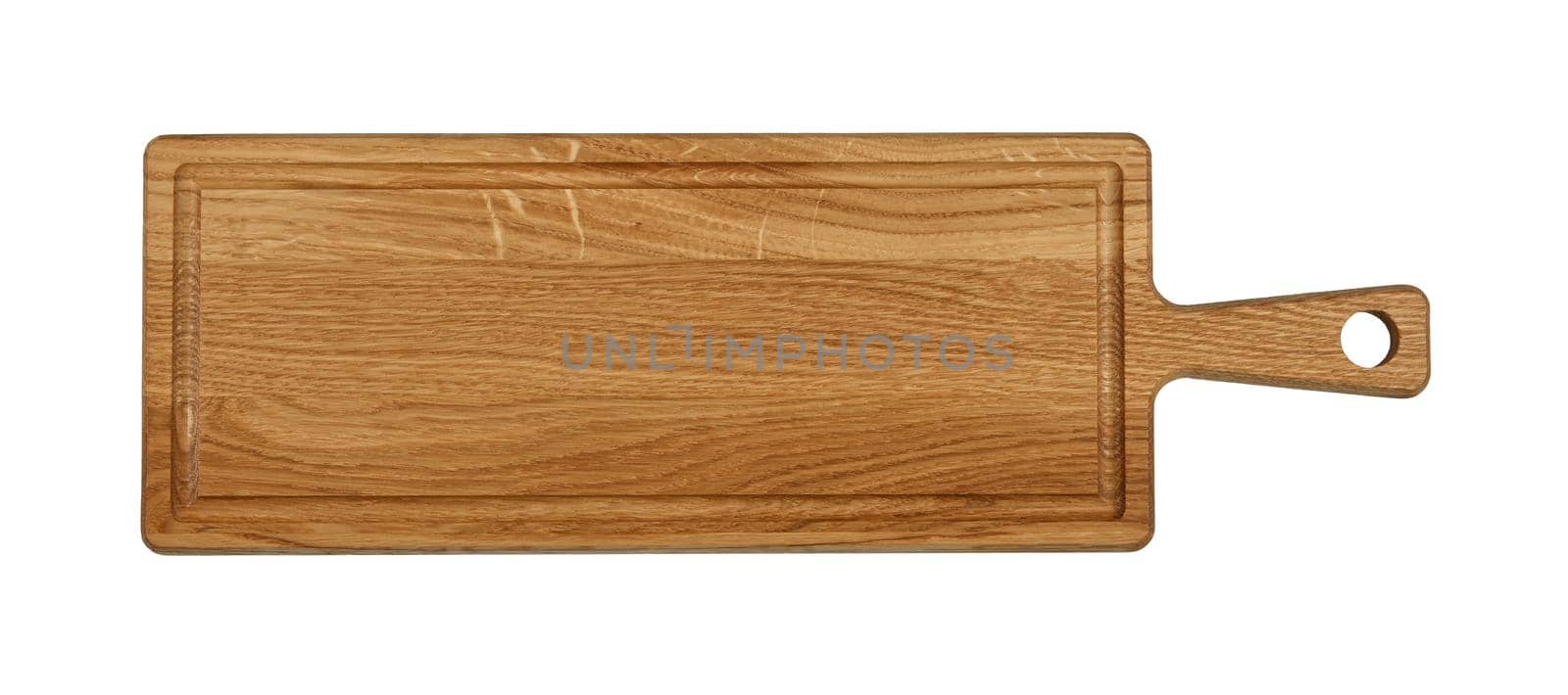 Close up of one rectangle shaped brown oak wood kitchen cutting board with handle and blood channel isolated on white background