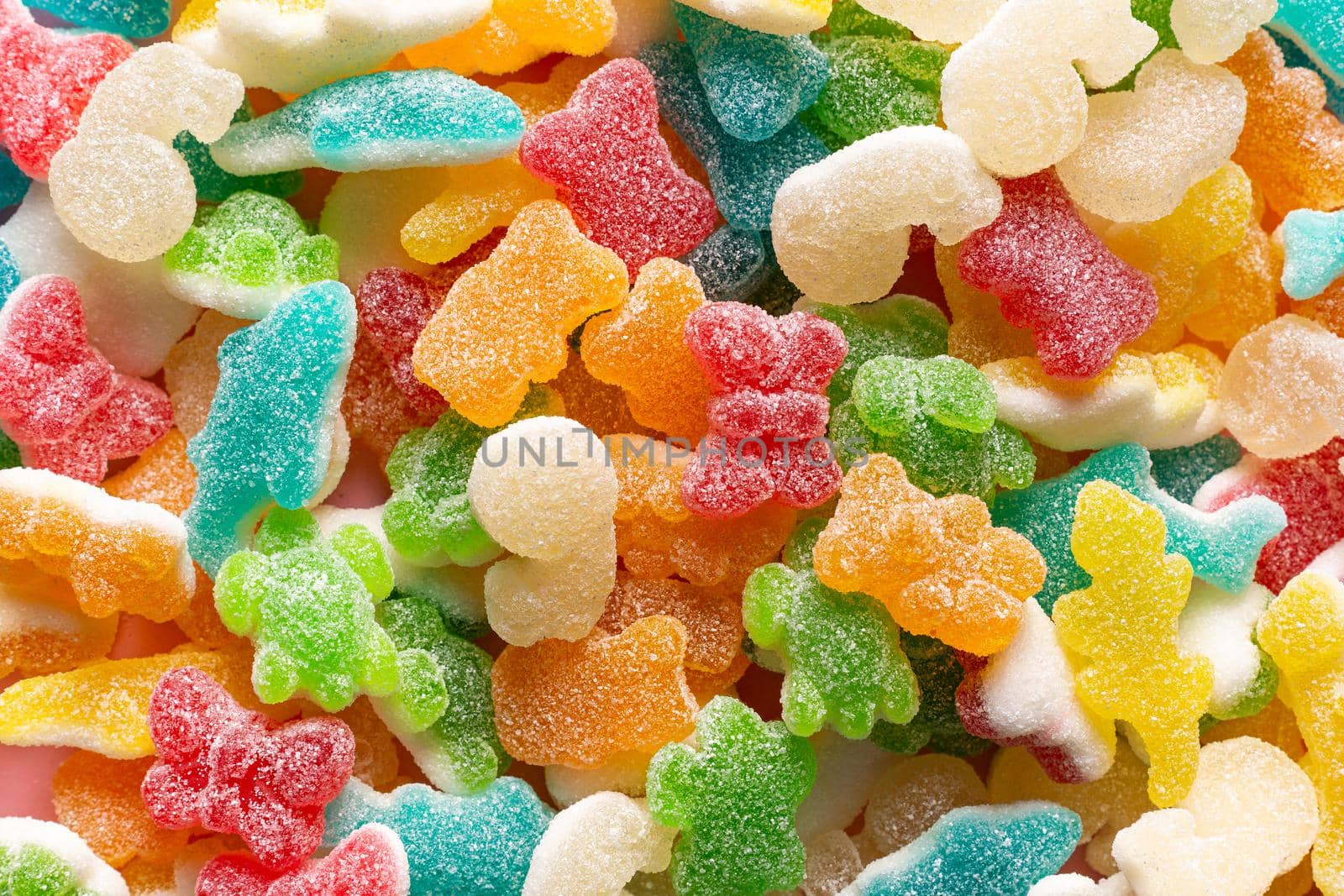 closeup of colored animal jelly beans with sugar occupying the entire horizontal image