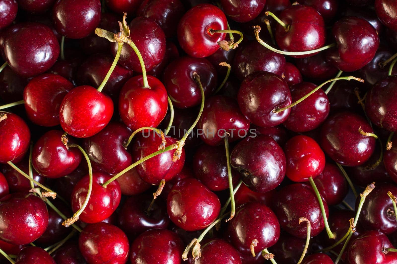 many cherries seen from above in the foreground