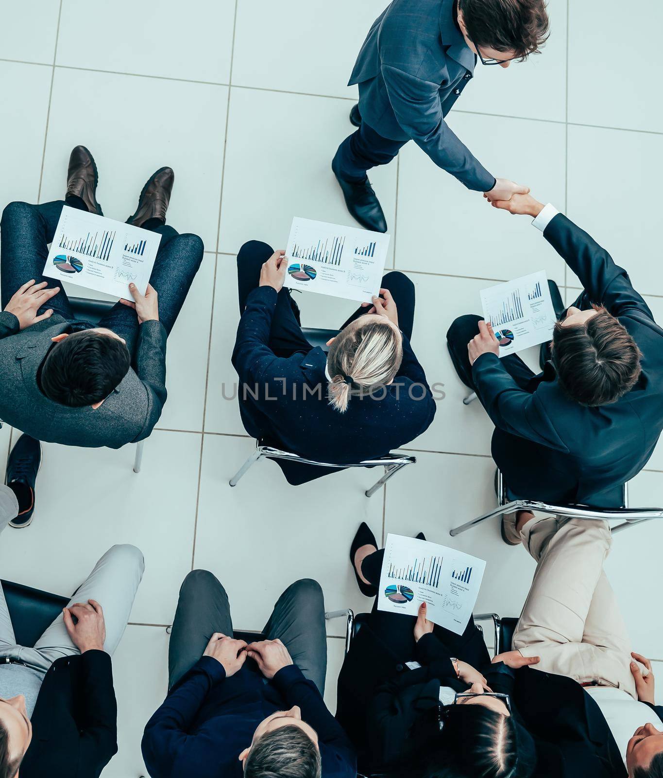 top view. business colleagues greeting each other at a business meeting.