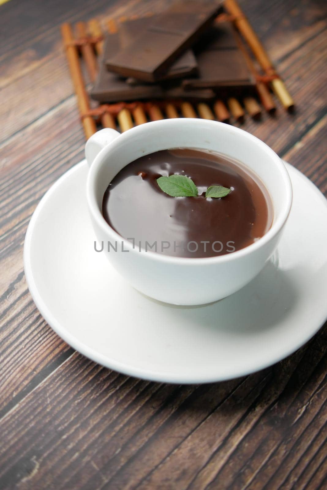dark chocolate cream in a coffee cup on table by towfiq007