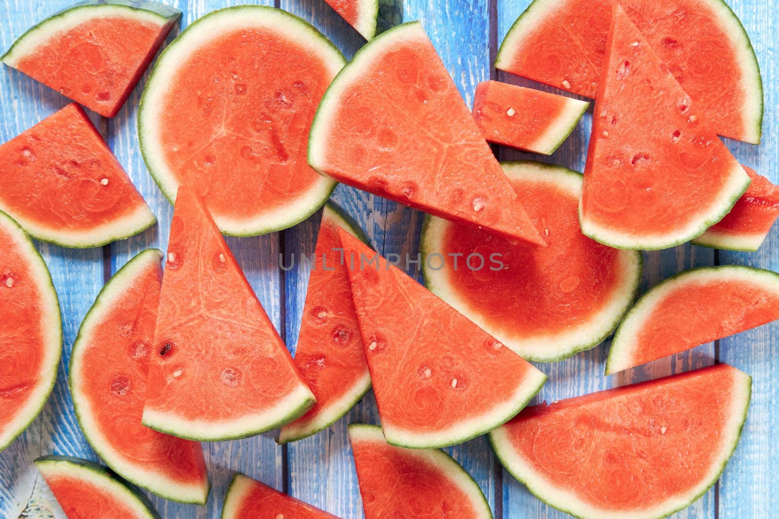 Watermelon cut into pieces to be served in a dining room