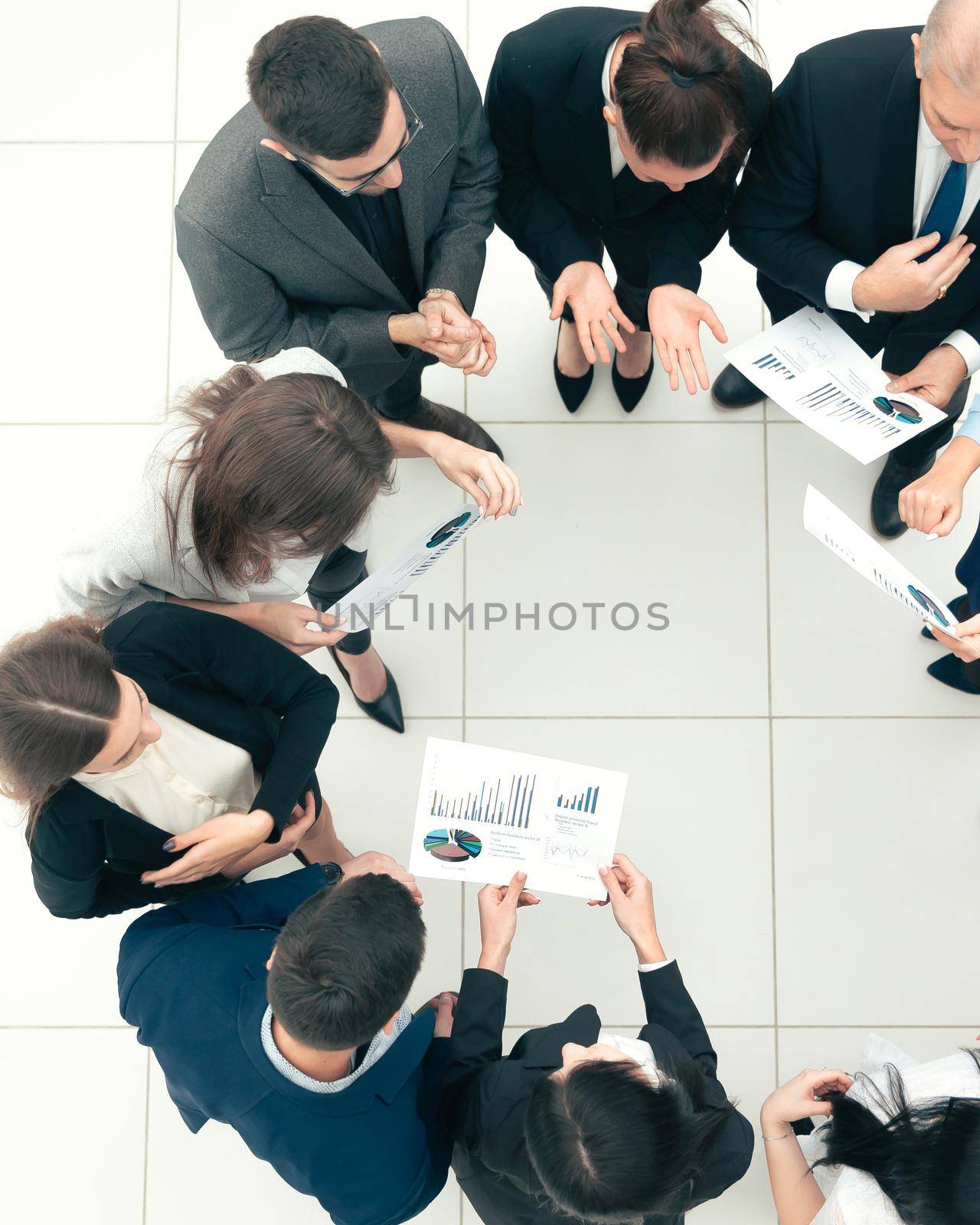 top view. group of corporate employees standing in a circle. photo with a copy of the space