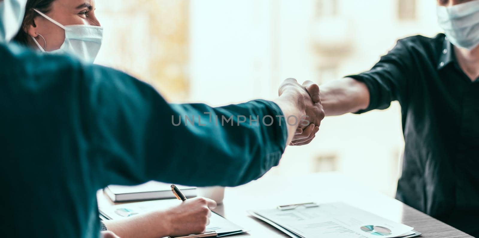 close up. financial partners are shaking hands with each other . by SmartPhotoLab