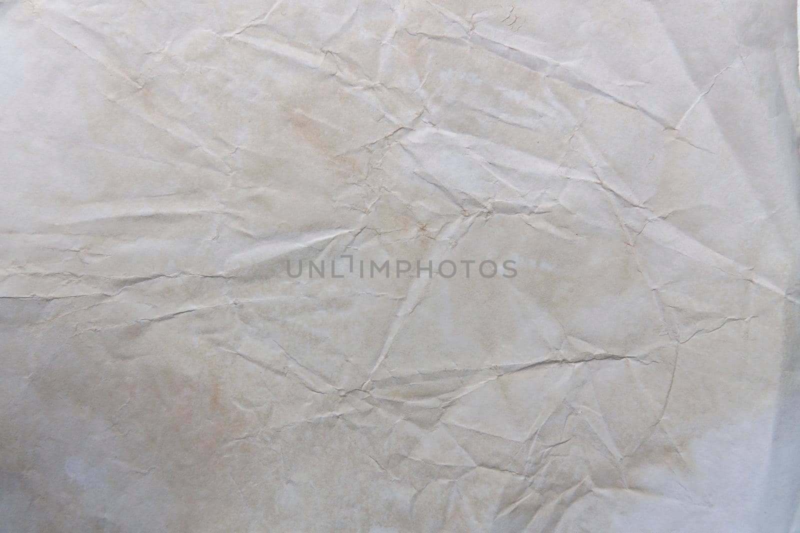 Texture wrinkled surface of yellowed old paper by elenarostunova
