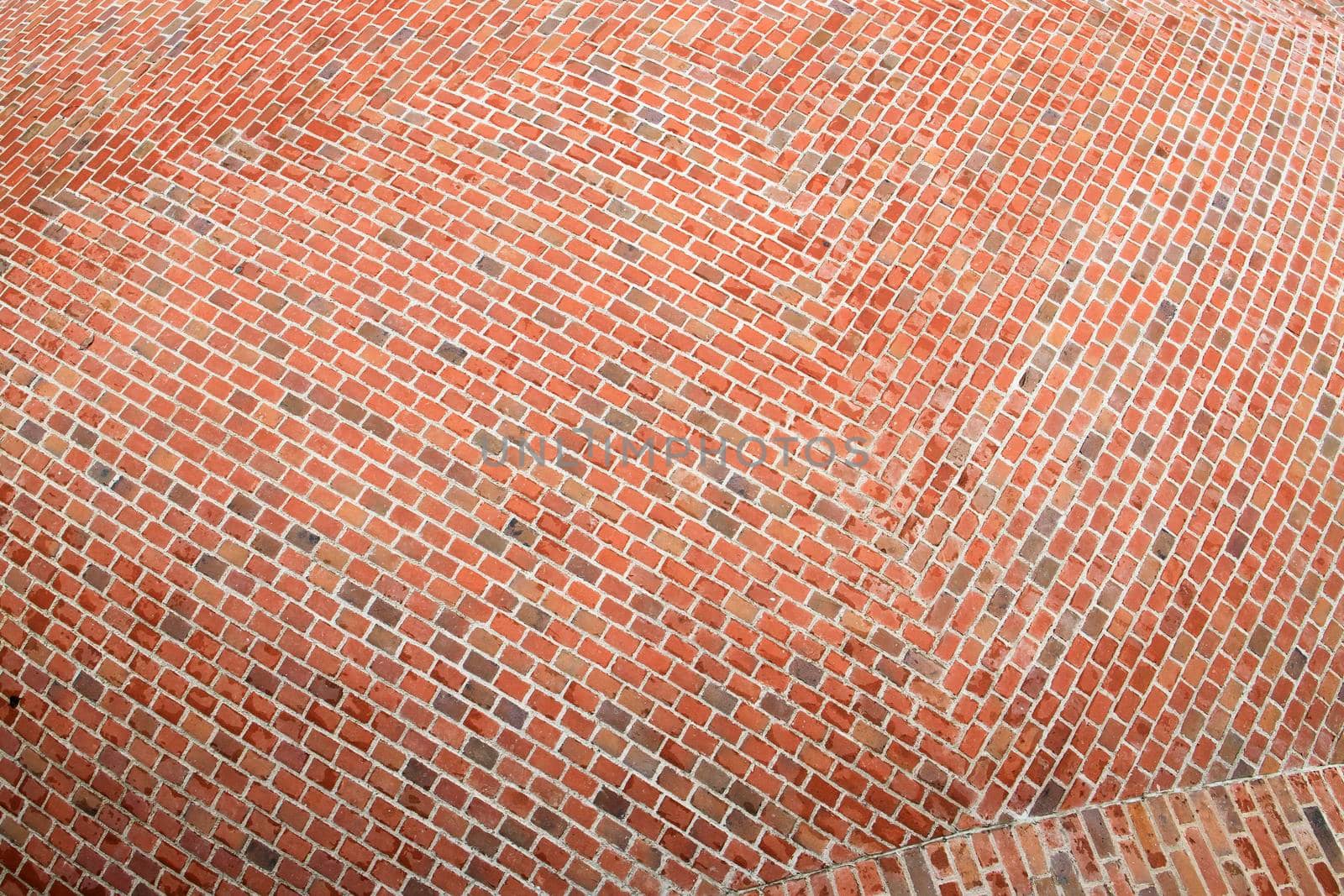 Fragment of the surface of a spherical red brick roof