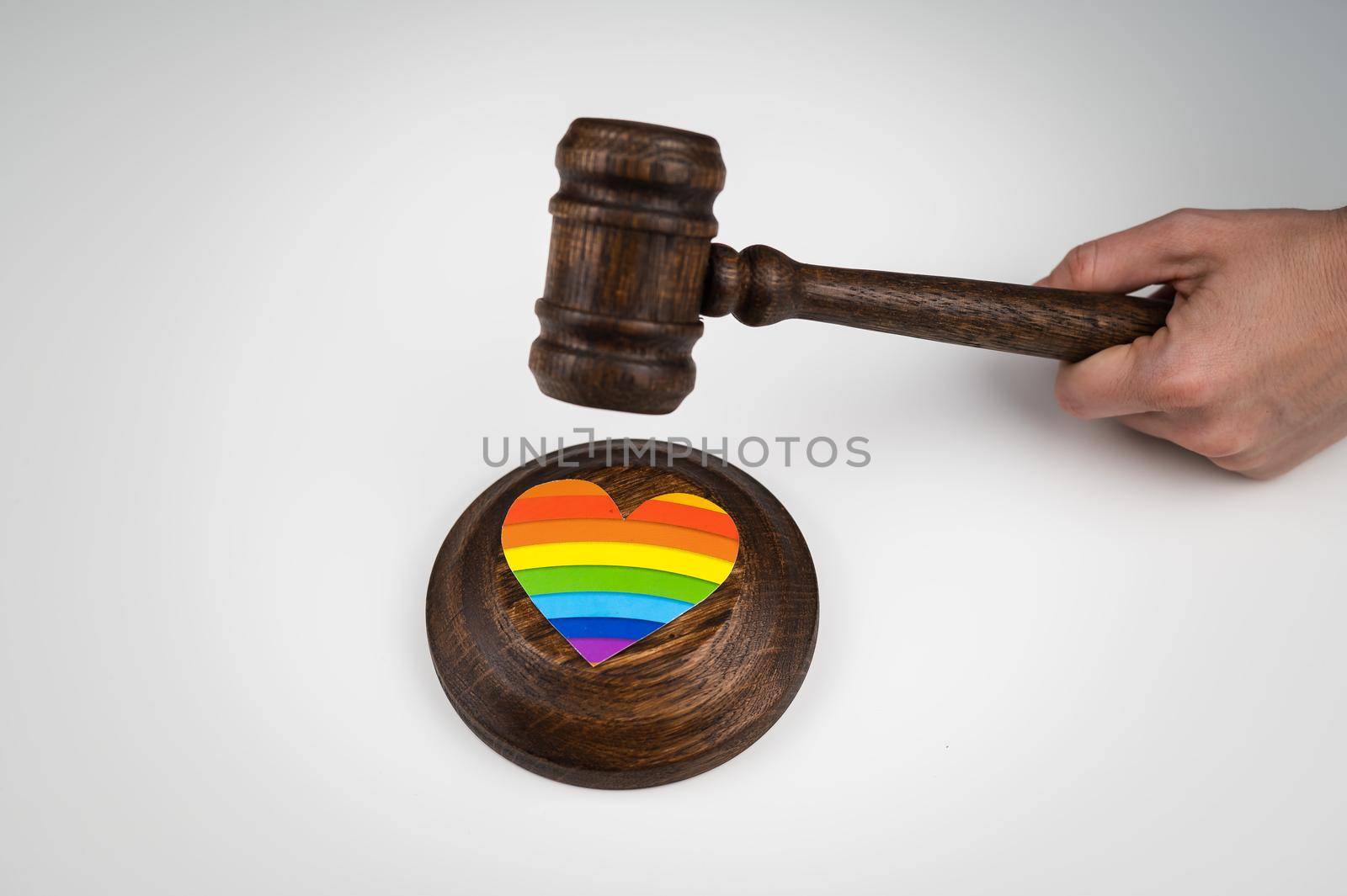 The judge hits a heart with a rainbow flag with a gavel. by mrwed54