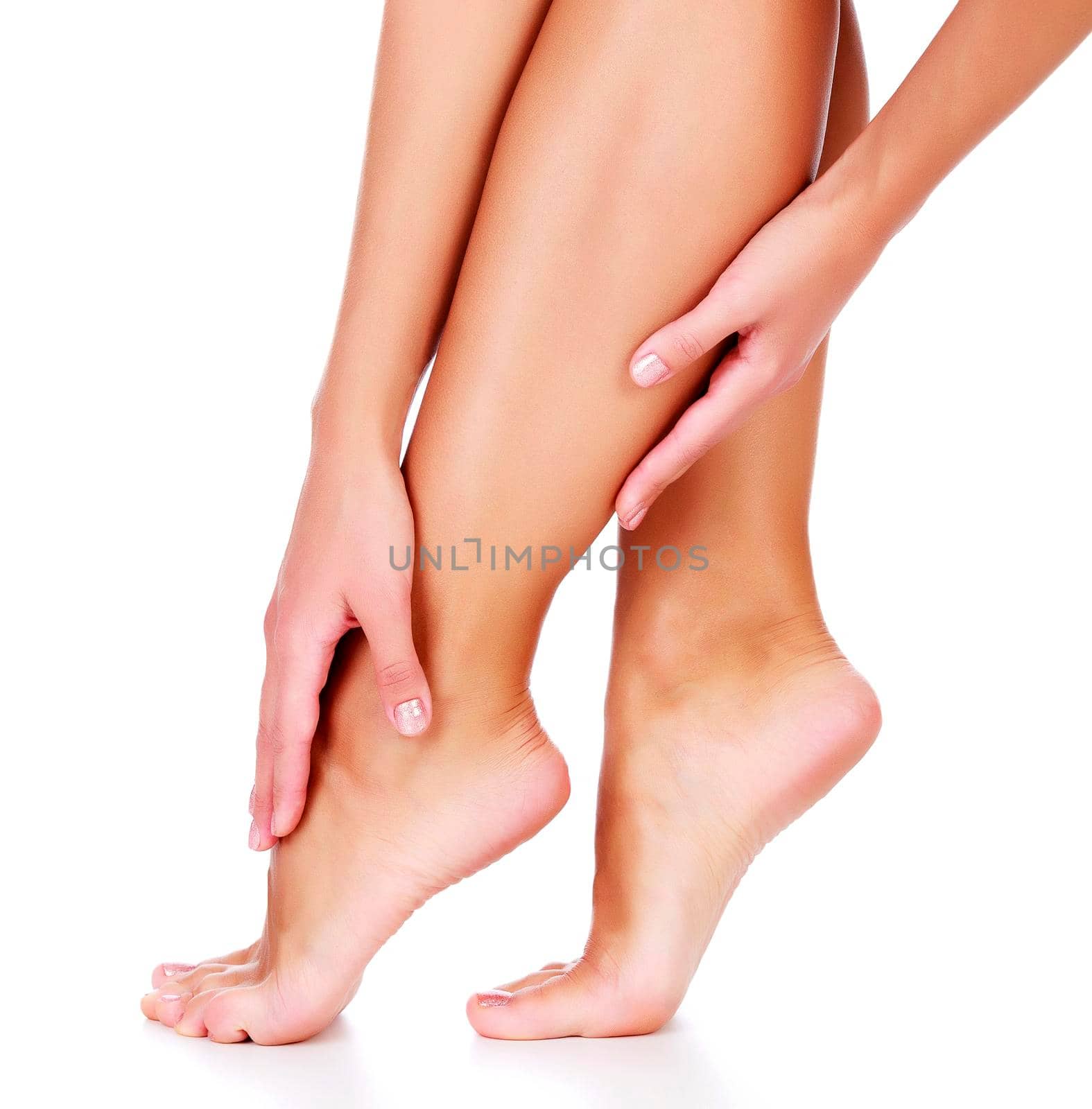 Female legs and hands, white background, isolated