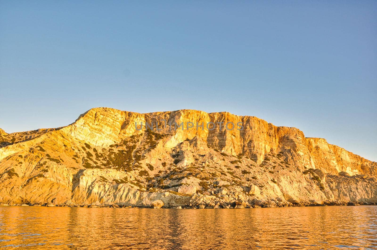 Matala Red beach coast with sand and blue sea by feelmytravel