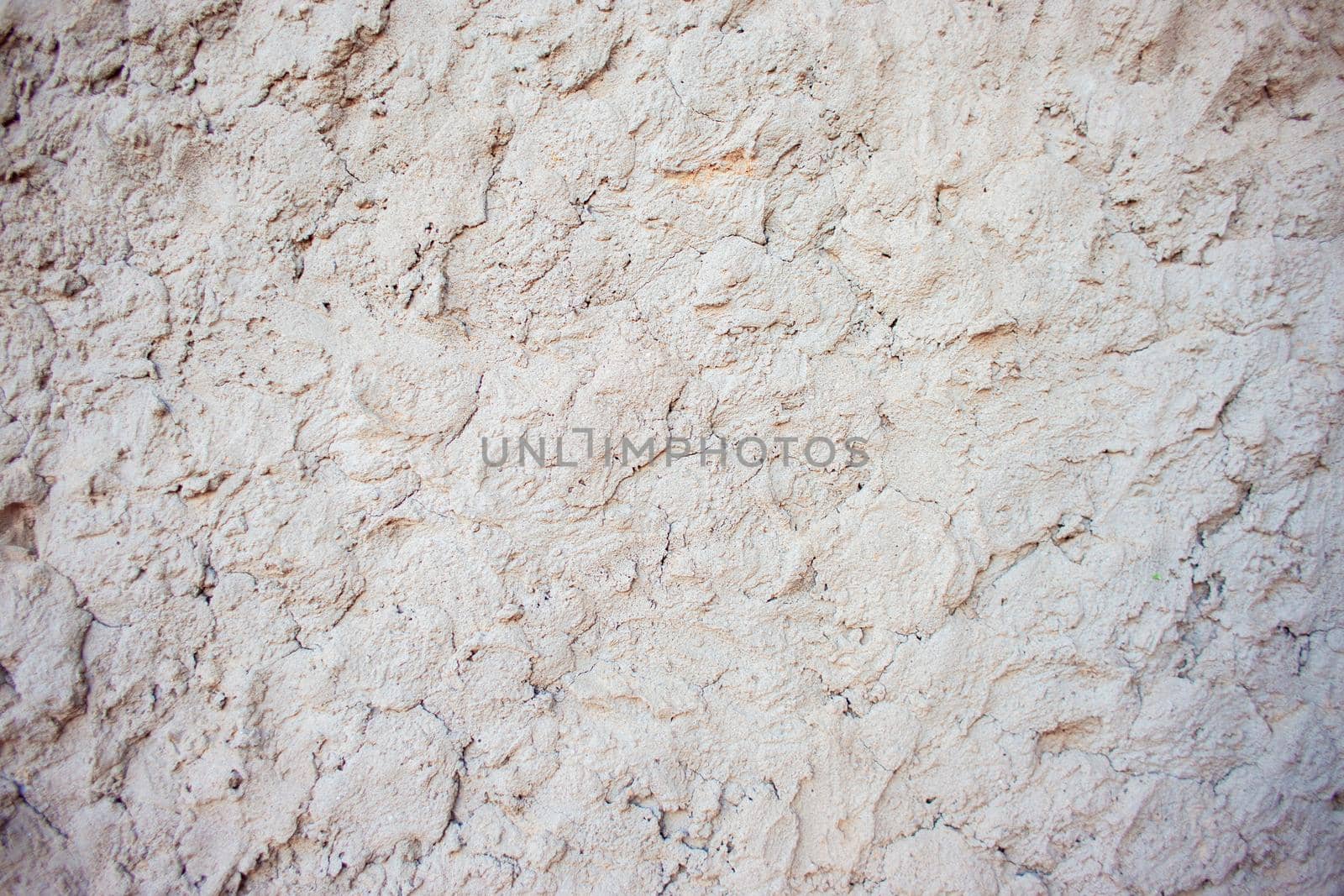 Abstract background of chaotically plastered cement on the wall by jatmikaV