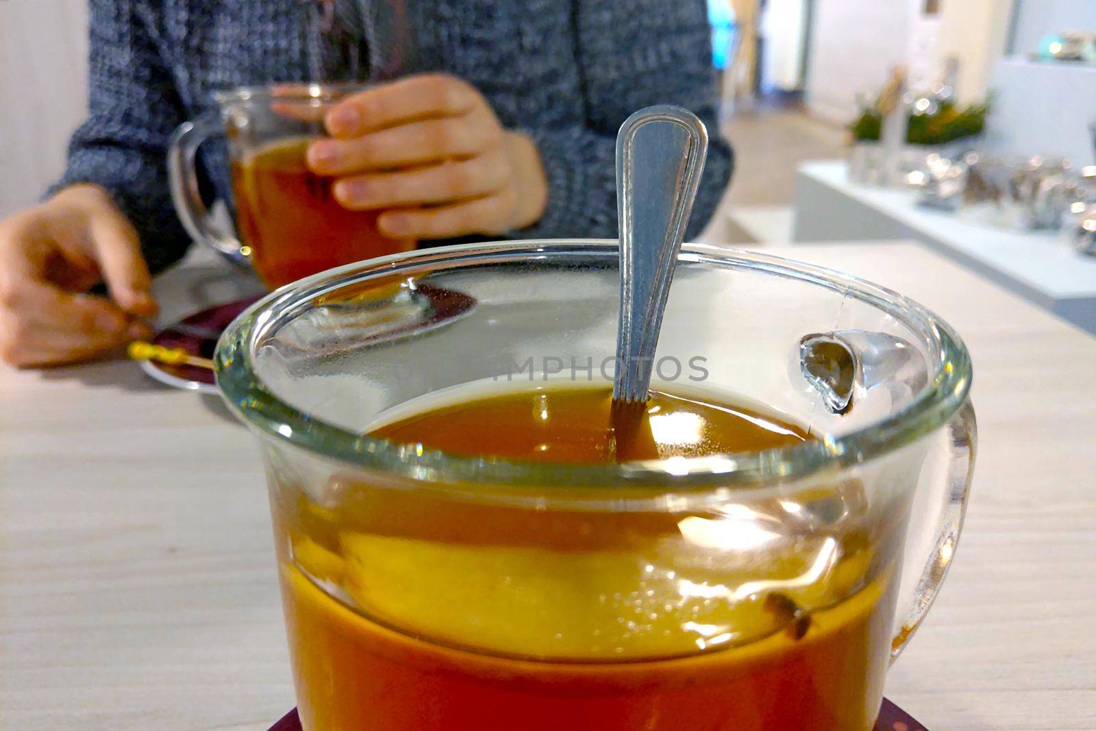 A mug of hot tea with lemon in a cafe