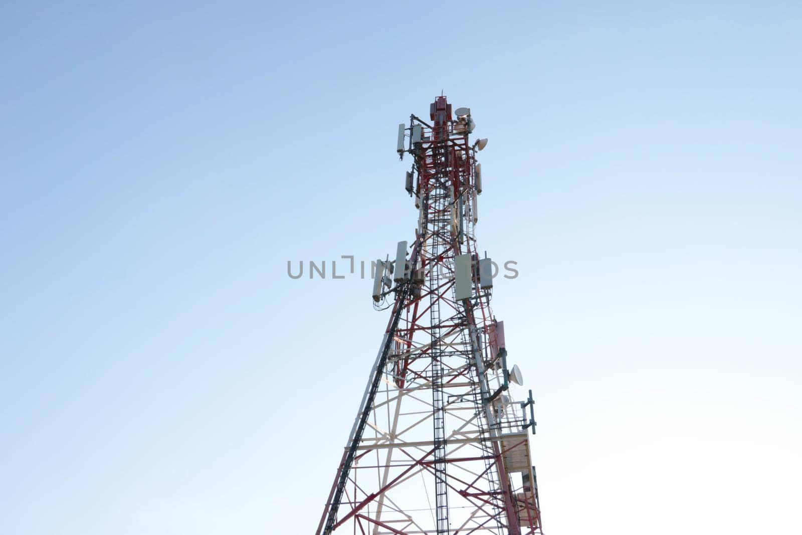 Modern mobile tower against the blue sky. Modern technologies. 5G