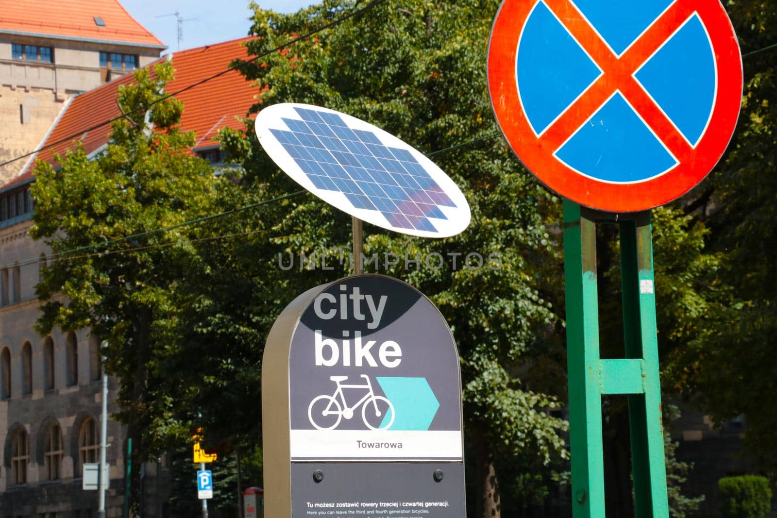 Poznan, Poland, July 15, 2021: city background. Bicycle stop, solar panel fast and useful energy
