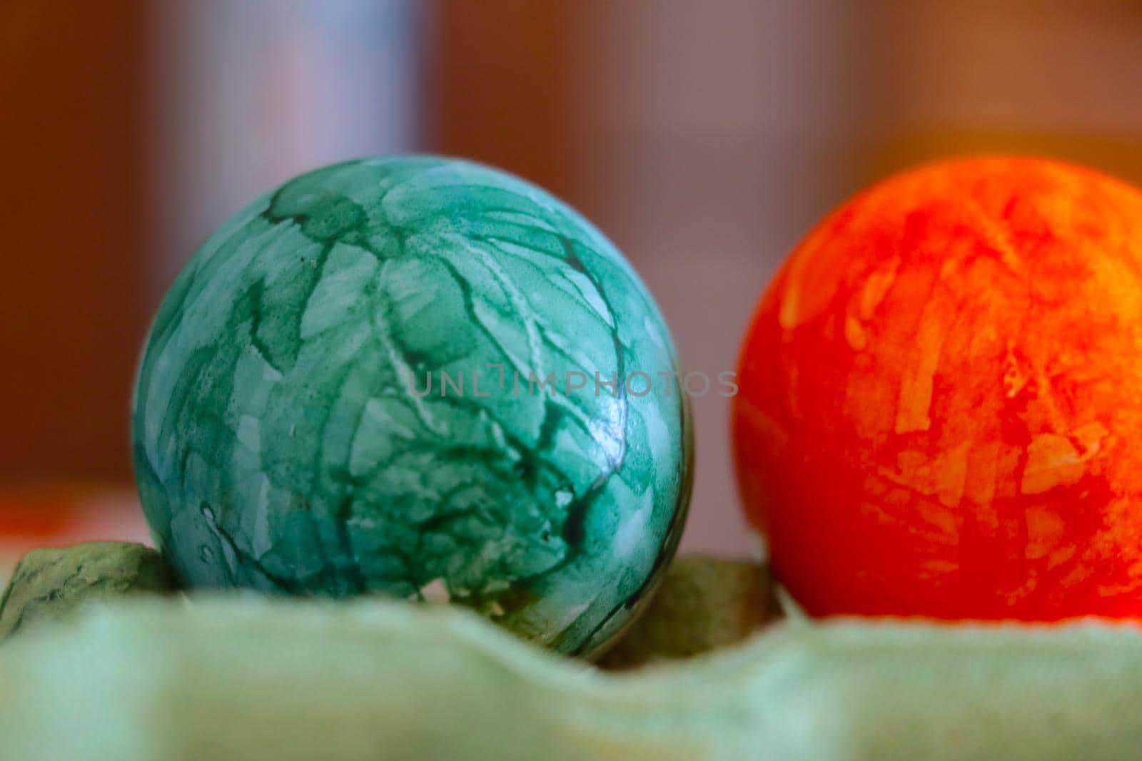 Colorful eggs in cardboard packaging, preparation for Easter
