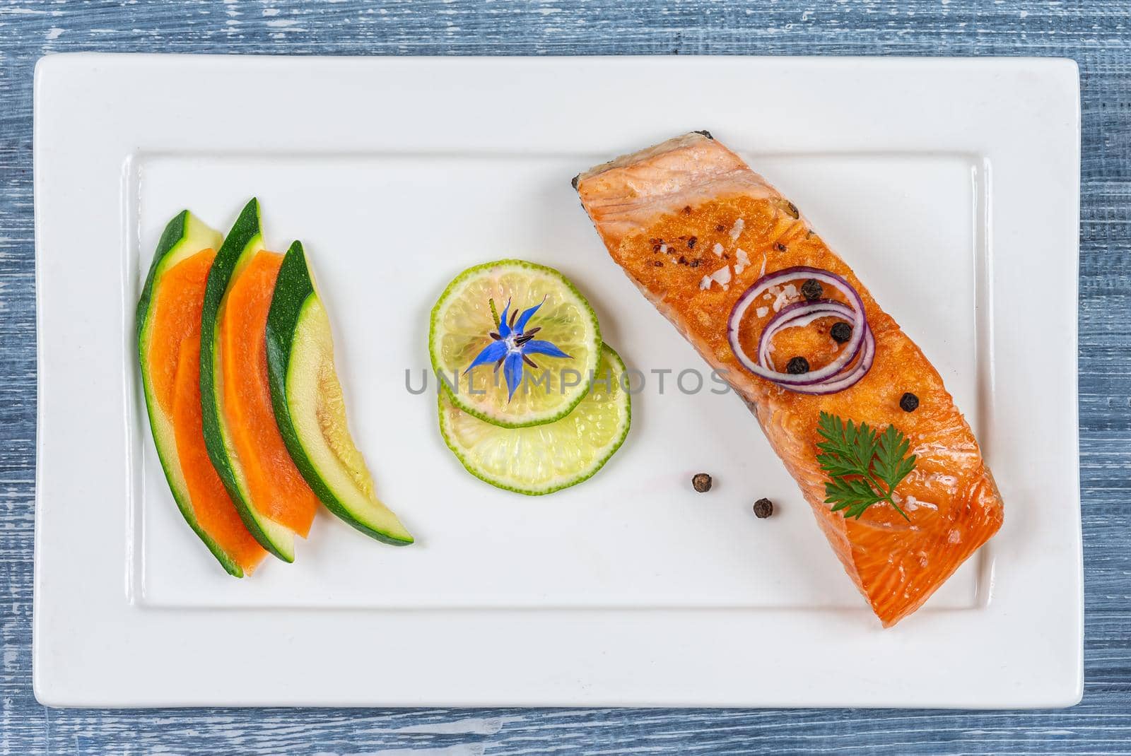 Mininalist presentation of a salmon plate - top view