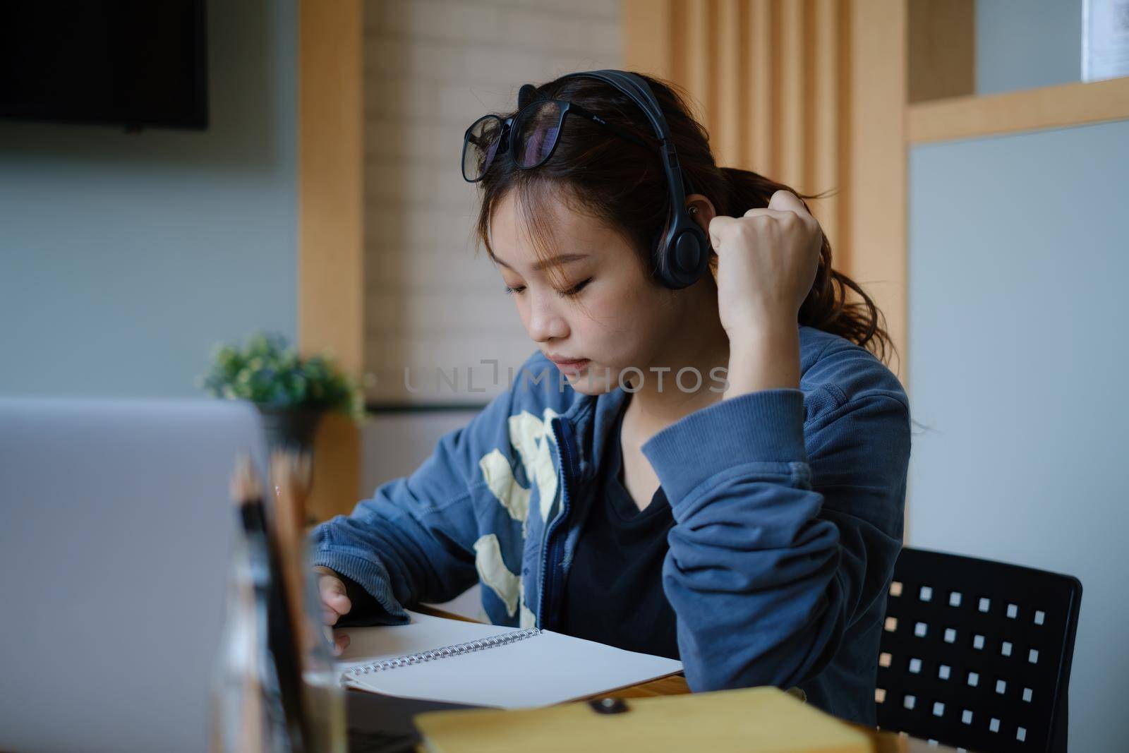 E-learning ,online ,education and internet social distancing protect from COVID-19 viruses concept. Asian woman student video conference e-learning with teacher on laptop computer at home