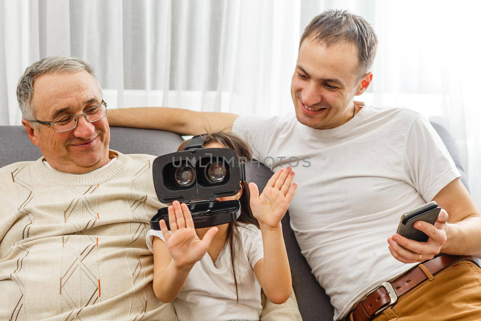 grandfather and granddaughter with virtual glasses.